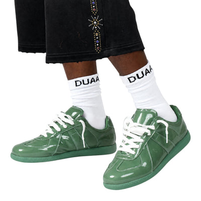 City Jeans Men's Duaa low-profile trainer in sage green patent leather with tonal rubber sole and white laces