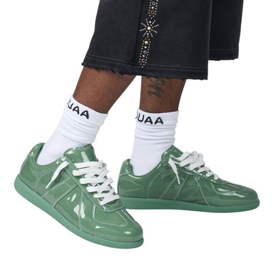 City Jeans men's sage green patent leather low-profile trainers with tonal rubber soles worn with white socks
